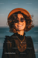 Smiling Woman in Straw Hat and Sunglasses Enjoying Summer Outdoors
