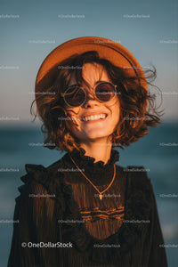 Smiling Woman in Straw Hat and Sunglasses Enjoying Summer Outdoors