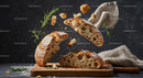 Rustic sourdough bread breaking with fresh rosemary sprigs
