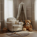 Cozy beige nursery corner with teddy bear and armchair