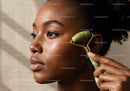 Close-up of a Black Woman Using Jade Roller for Skin Rejuvenation