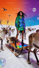 Confident woman in iridescent coat stands on reindeer sleigh