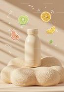 Minimalist bottle with citrus fruits on textured platform