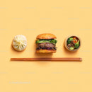 Gourmet Burger with Lettuce and Tomato Next to Grilled Steak and Dumpling