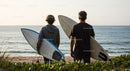Two Surfers with Surfboards at Beach Ready for Waves