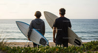 Two Surfers with Surfboards at Beach Ready for Waves