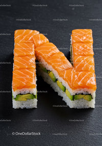 Sushi Rolls Arranged in Letter N with Salmon and Avocado