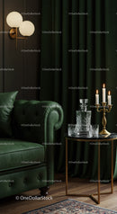 Cozy living room corner with green leather sofa and candles