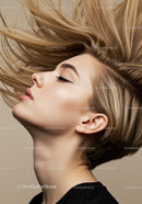 Profile of young woman with flowing blonde hair