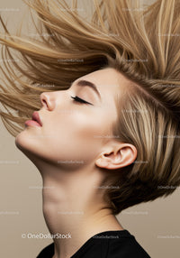 Profile of young woman with flowing blonde hair