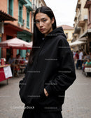Fashionable Woman Wearing Black Hoodie in Urban City Street