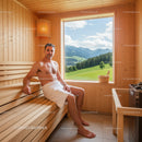 Man Relaxing in Wooden Sauna with Scenic Mountain View