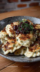 Crispy Pan-Fried Dumplings with Savory Filling and Herbs
