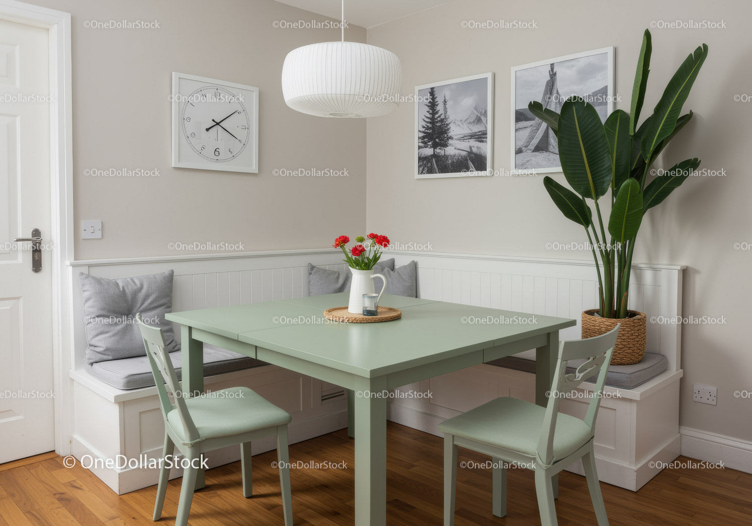 Bright and Cozy Kitchen Corner with Green Accent Table and Indoor Plants