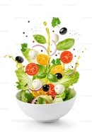 Fresh vibrant salad ingredients tossed with olive oil splash