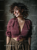 Stylish Woman with Curly Hair Smiling Indoor Portrait