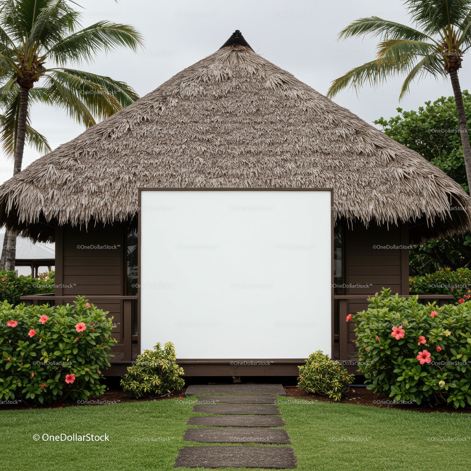 Tropical bungalow with blank white sign surrounded by greenery
