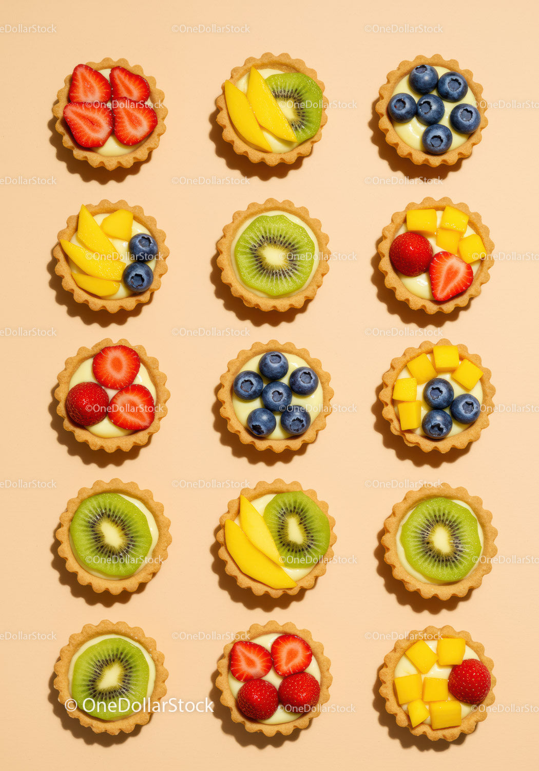 Colorful Mini Fruit Tarts Arranged on Light Background