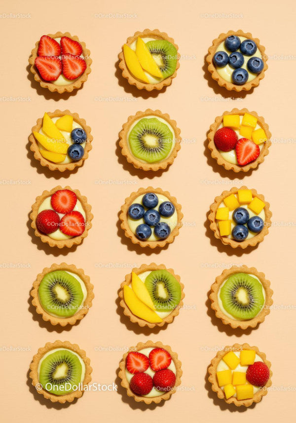 Colorful Mini Fruit Tarts Arranged on Light Background