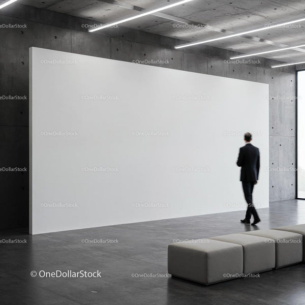 Man walking past large blank white gallery wall JPG Mockup Image