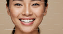 Close up of smiling young woman with flawless skin
