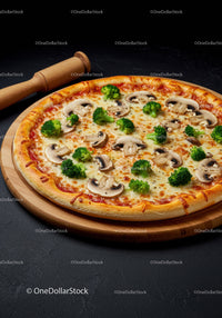 Fresh mushroom and broccoli pizza on wooden board