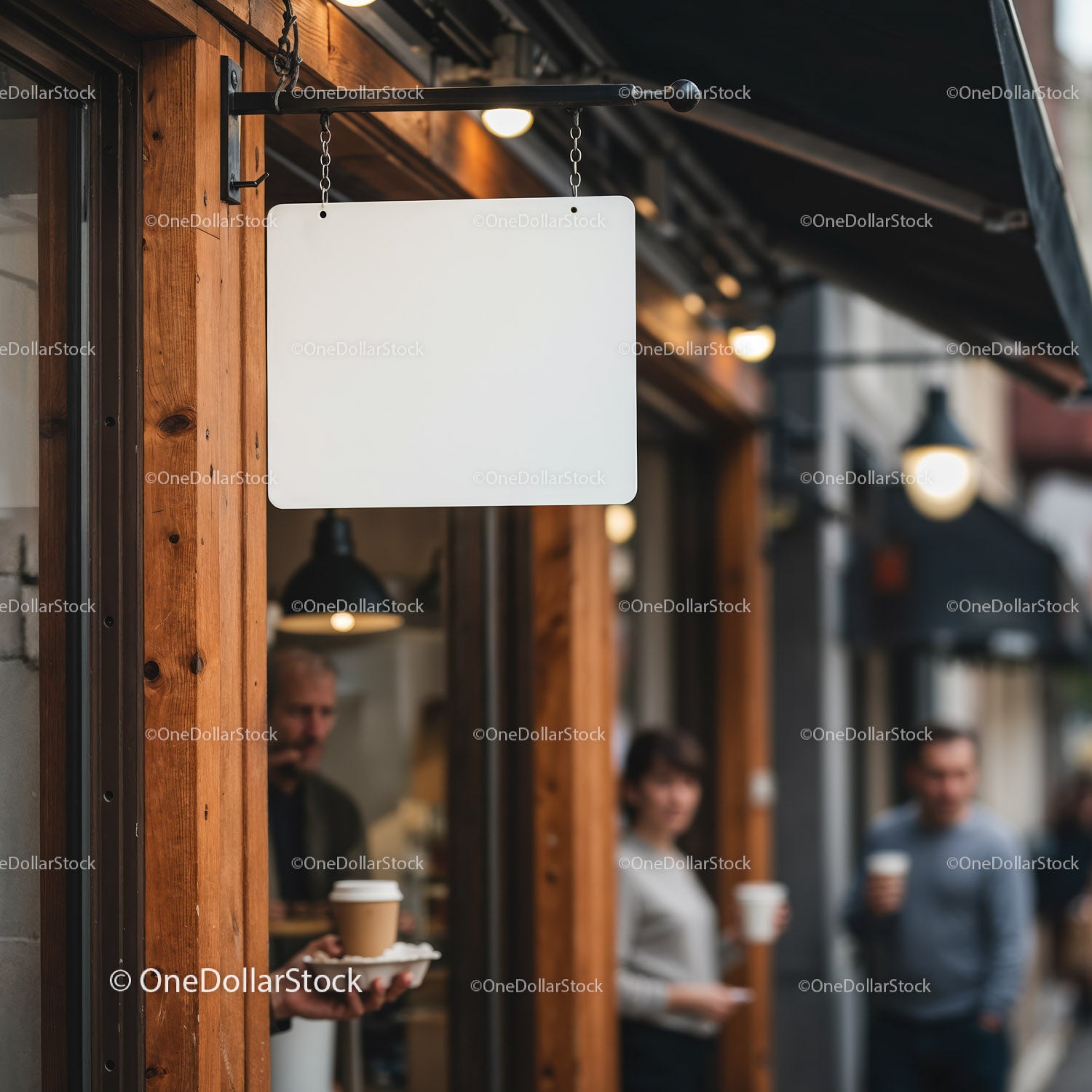 Blank hanging sign outside urban coffee shop entrance
