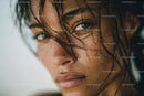 Close-Up of Woman with Wet Hair and Bright Blue Eyes in Natural Light