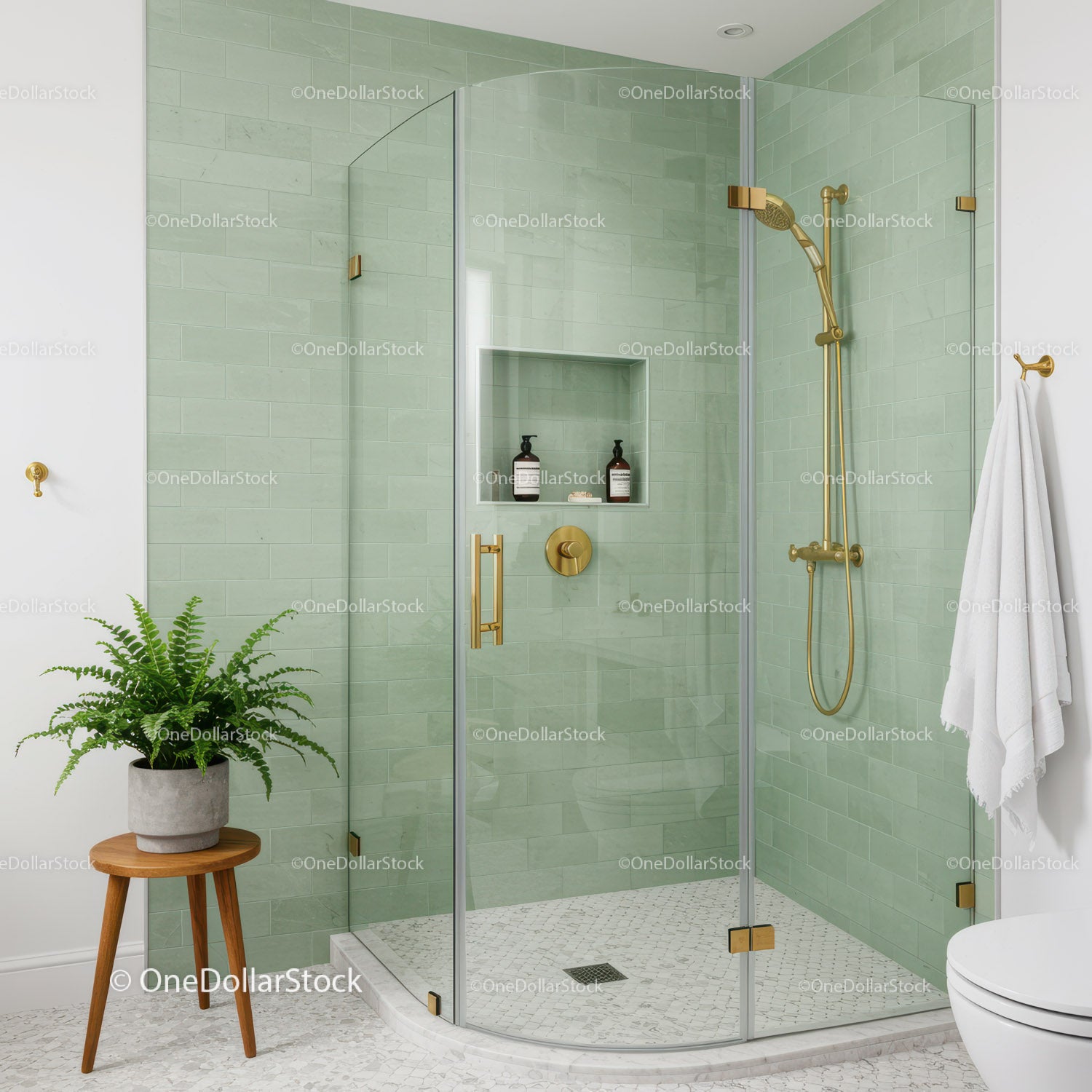 Modern bathroom with glass shower and green tiles