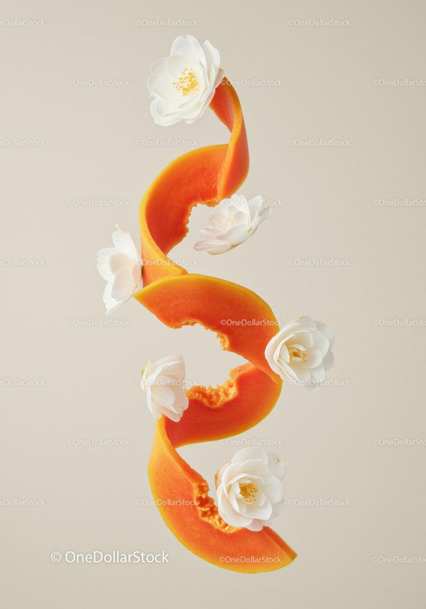 Twisted Papaya Peel with White Blossoms on Neutral Backdrop