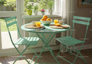 Sunny breakfast nook with orange juice and fresh fruit