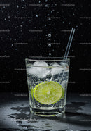 Refreshing glass of sparkling water with lime and ice