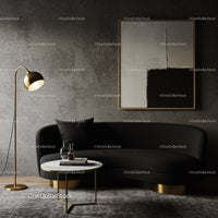 Modern living room with black sofa and gold accents