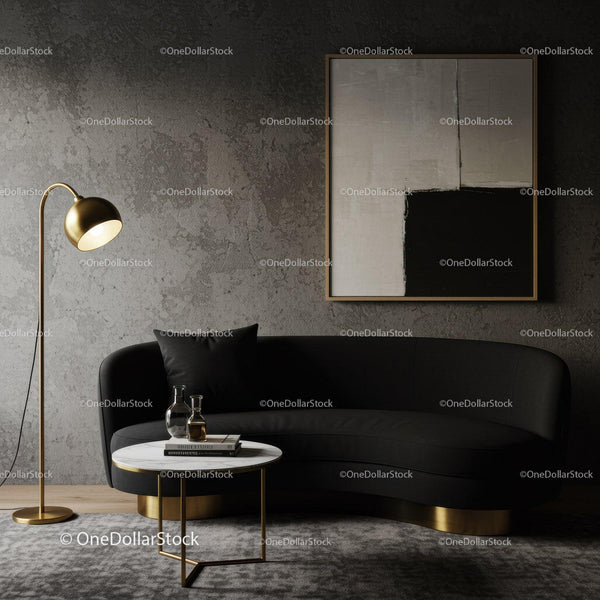 Modern living room with black sofa and gold accents