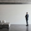 Businessman walking in modern minimalist interior space