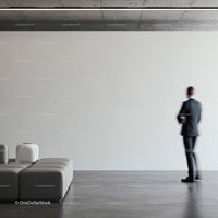 Businessman walking in modern minimalist interior space