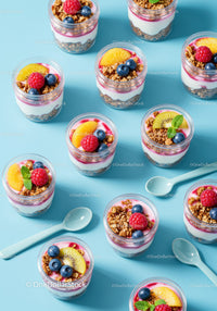 Healthy layered yogurt parfait jars with fresh fruit toppings