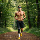 Male Runner with Prosthetic Leg Running Through Foggy Forest Trail