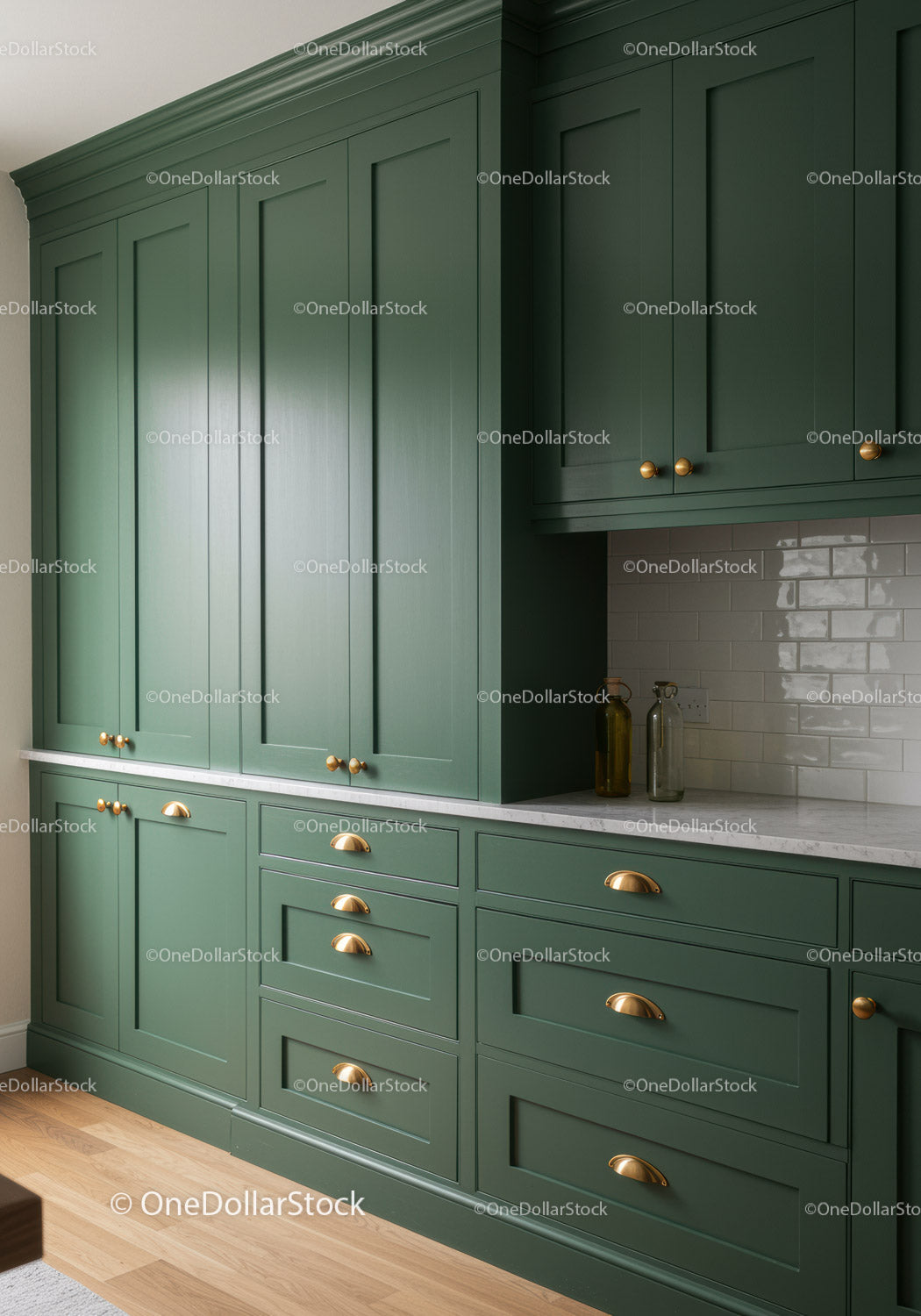 Modern Green Kitchen Cabinets with Brass Handles and Marble Countertop