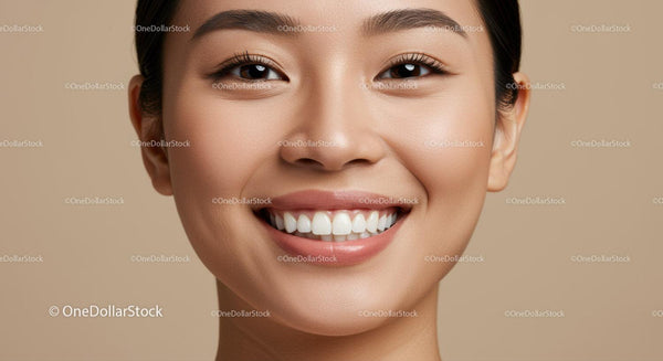 Close up of smiling young woman with flawless skin