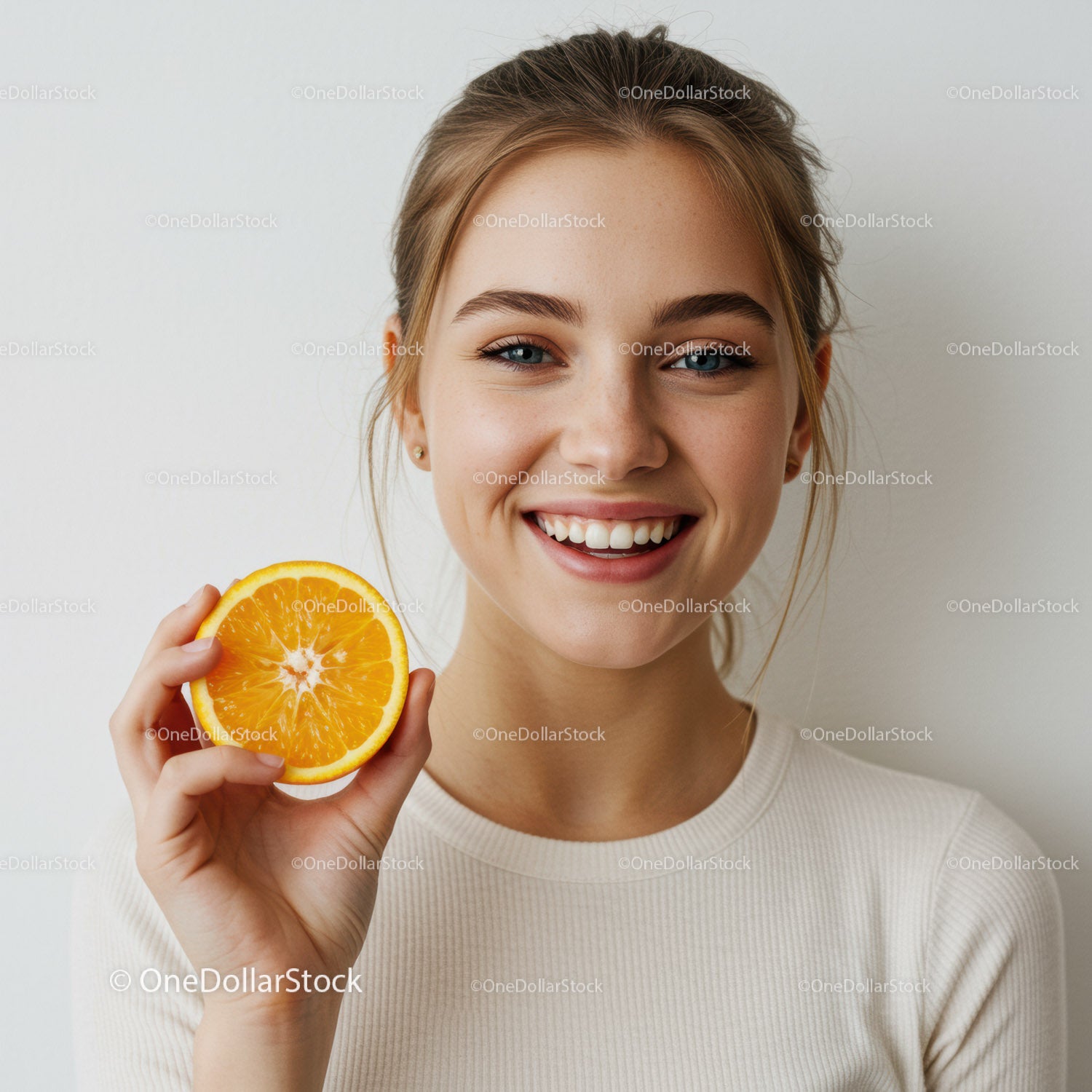 Young Woman Smiling with Orange Slice Bright Summer Vitality