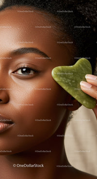Elegant Black Woman with Glowing Skin Holding Green Jade Heart