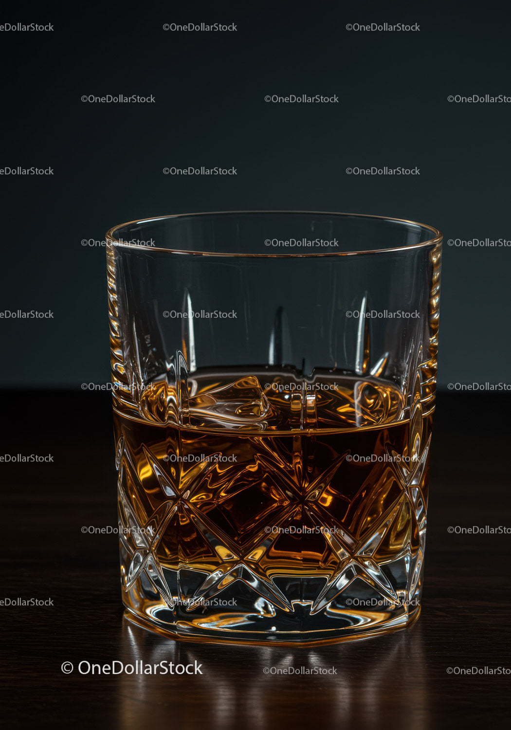 Elegant Crystal Glass of Amber Whiskey with Carved Pattern