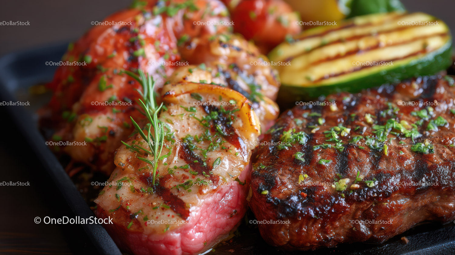 Grilled Steak and Zucchini with Fresh Herbs on a Black Plate