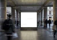 Blank illuminated billboard in urban pedestrian corridor