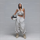 Stylish Woman in Metallic Outfit Holding Disco Ball for Modern Fashion