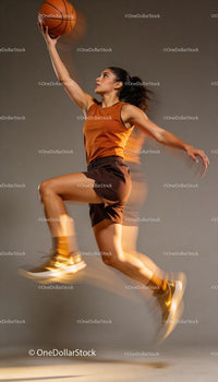 Athletic Woman Jumping for Basketball Layup