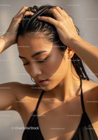 Sunlit Portrait of a Young Woman with Black Hair and Natural Beauty