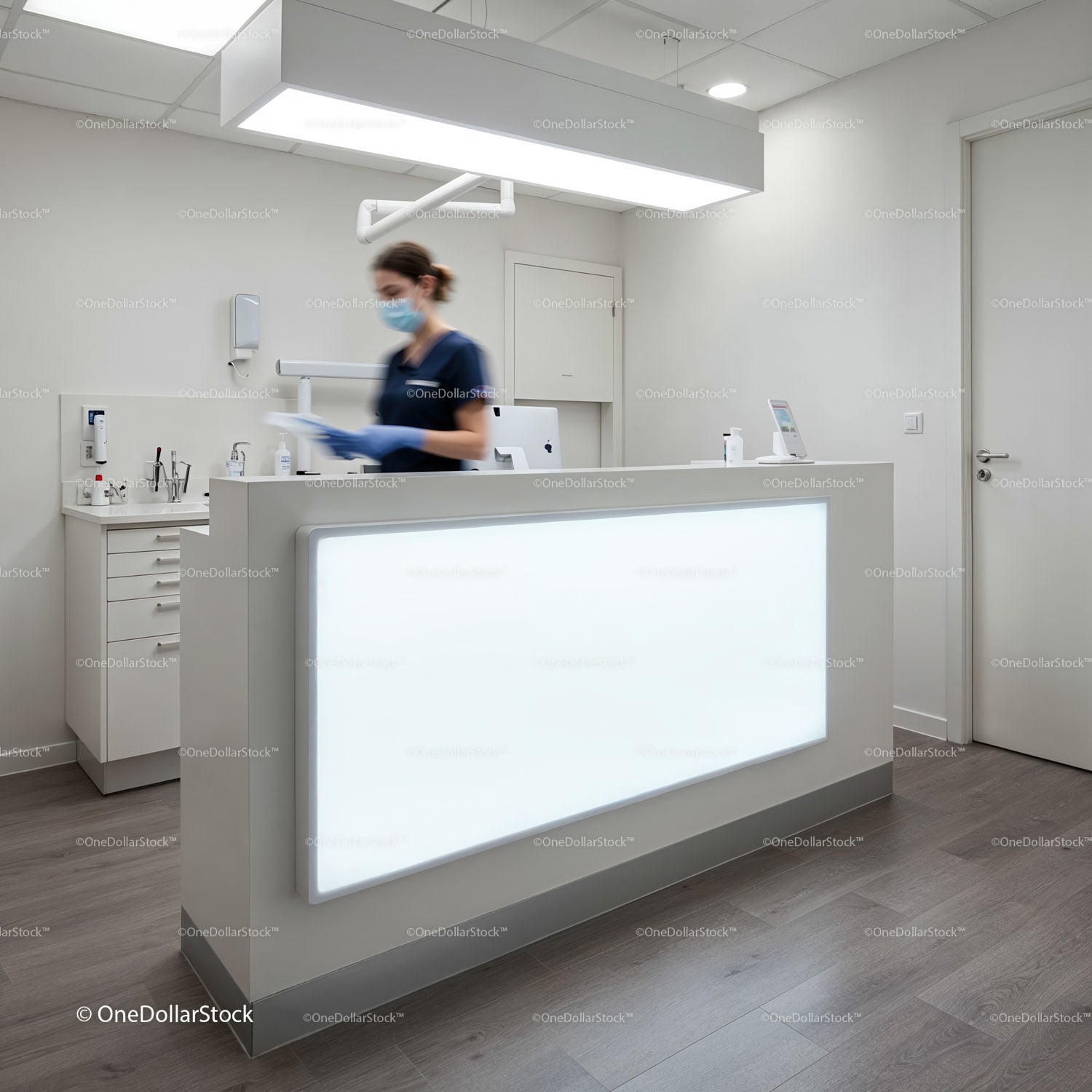Medical professional organizing documents in clinic reception