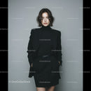 Professional Woman in Stylish Black Suit Standing confidently
